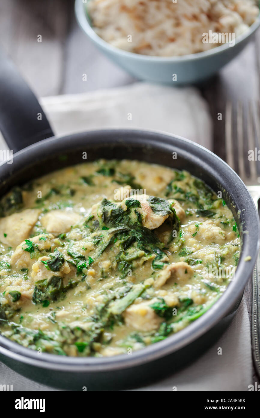 Chicken with curry, spinach and lentils Stock Photo Alamy