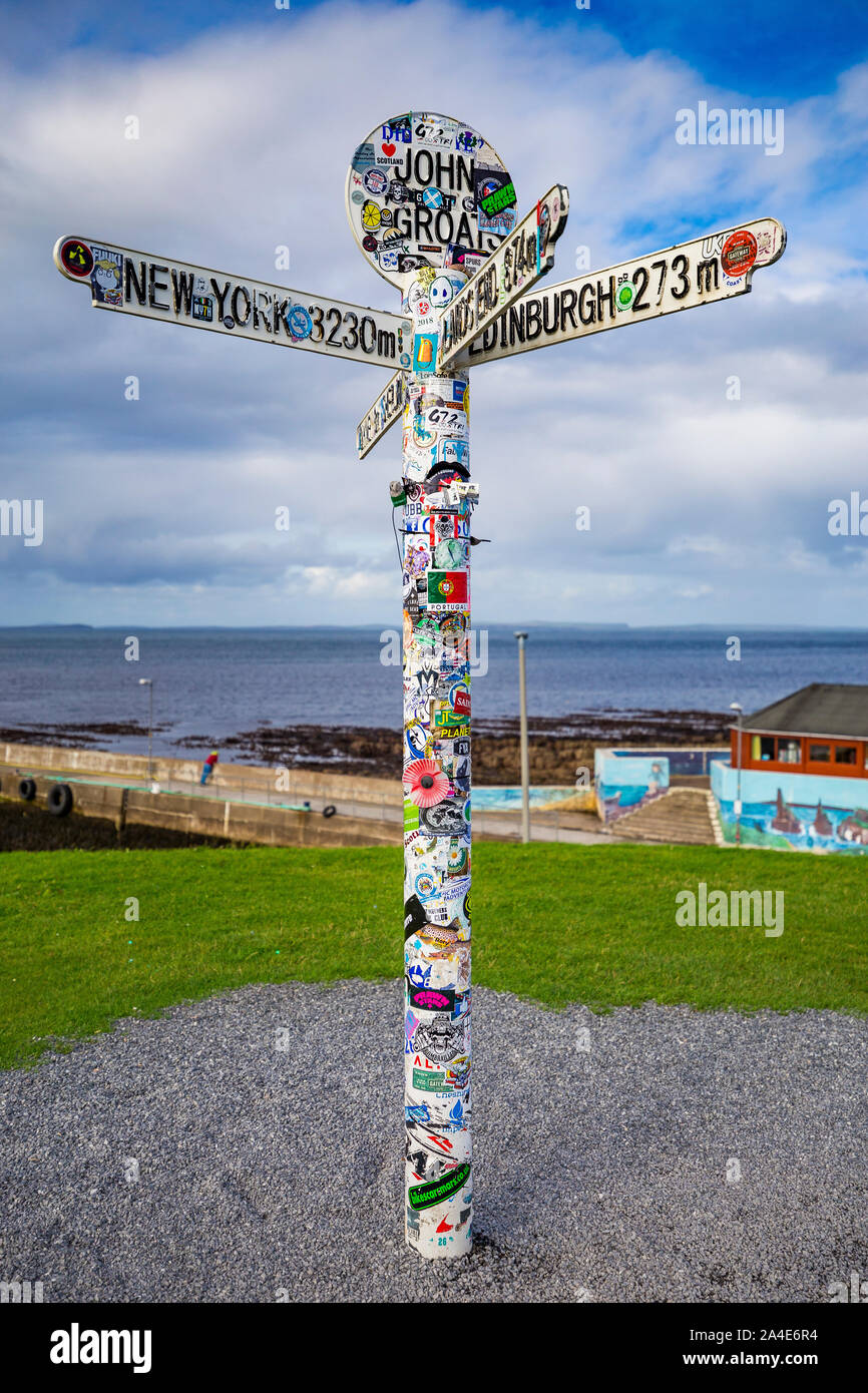 John O'Groats Signpost covered in stickers Stock Photo