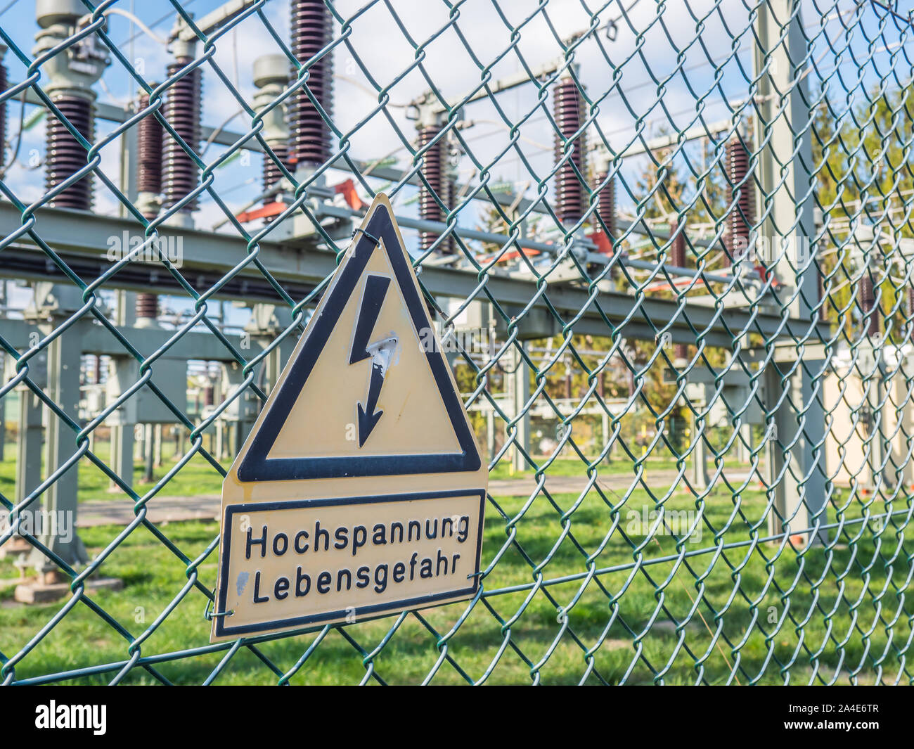 Electric coils and transformers warning sign in german Stock Photo