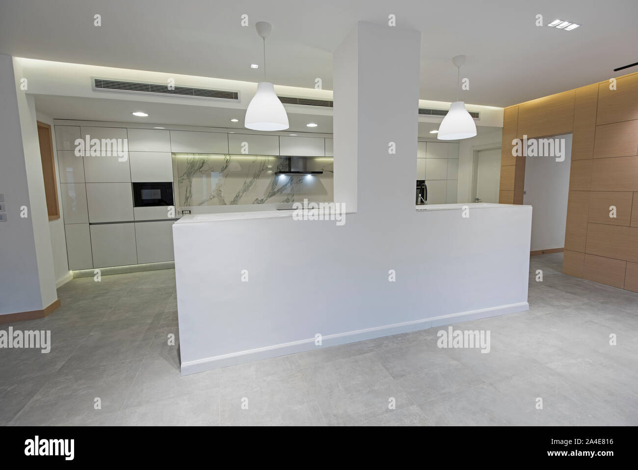 Interior design decor showing modern kitchen with island in luxury apartment showroom Stock Photo