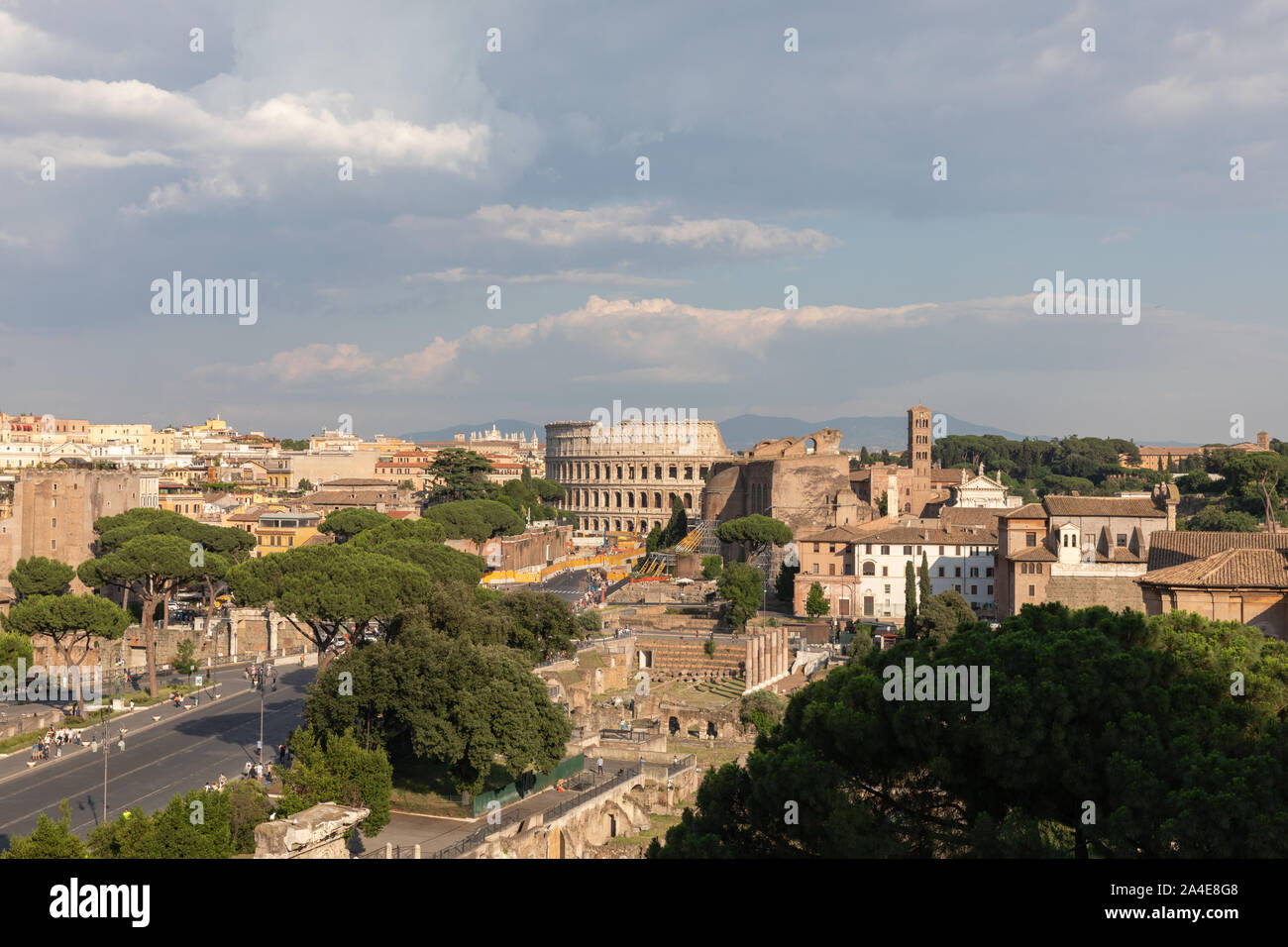 Panoramic view of city Rome with Roman forum and Colosseum from Vittorio Emanuele II Monument also known as the Vittoriano. Summer sunny day and drama Stock Photo