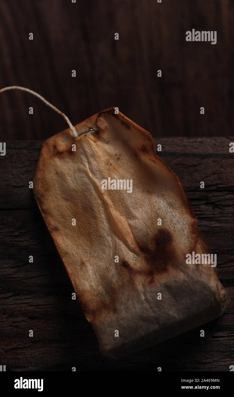 The old tea bag on the wooden floor Stock Photo