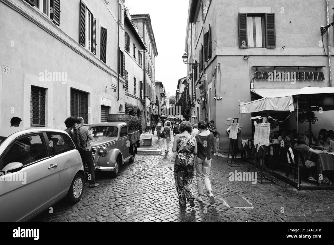 Rome, Italy - June 23, 2018: Panoramic view of Trastevere is 13th district of Rome on west bank of the Tiber, south of Vatican City. People walk and r Stock Photo