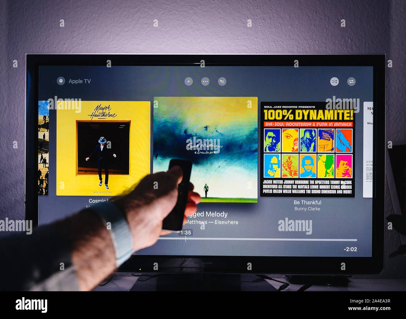 Paris, France Circa 2019 Man hand holding remote control of Apple TV