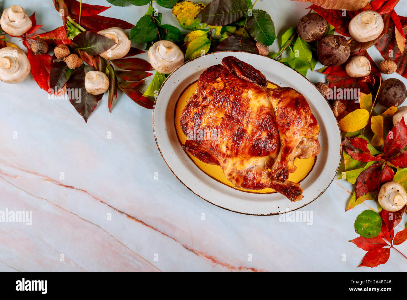 Thanksgiving celebration dinner with golden roast chicken Stock Photo