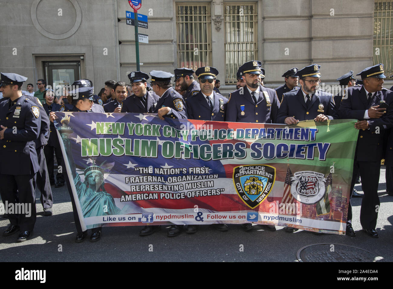 American Muslim Day Parade on Madison Avenue in New York City. Members of the Muslim Officers Society of the NYPD ready to carry their banner in the parade. Stock Photo