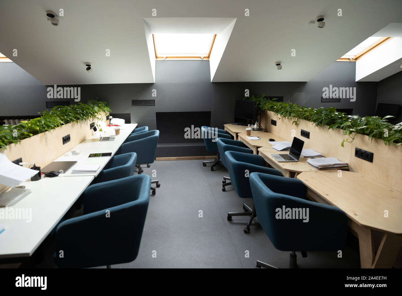 Empty co-working workplace modern open space no people Stock Photo