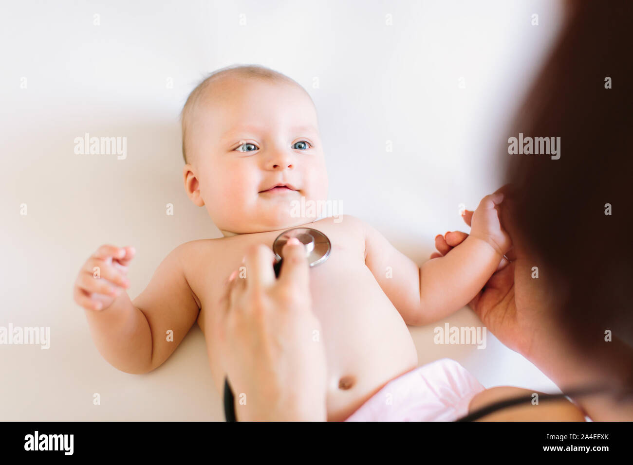 Doctor Using A Stethoscope To Listen To Baby's Chest , Baby Health Concep Stock Photo Alamy