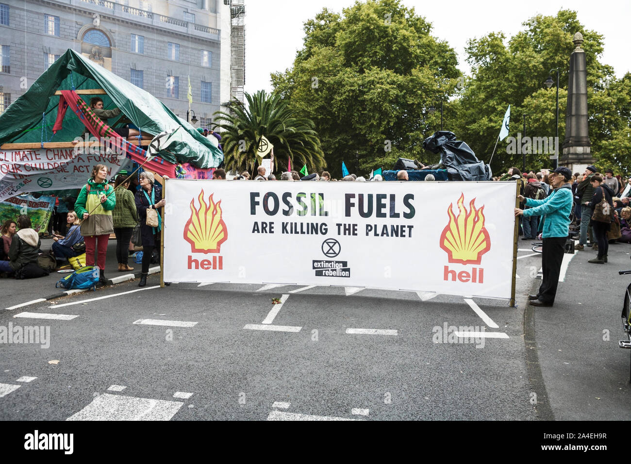 Extinction Rebellion London - environmental protest activists - demanding governments take action against climate change. Climate protest. Oil protest. Stock Photo