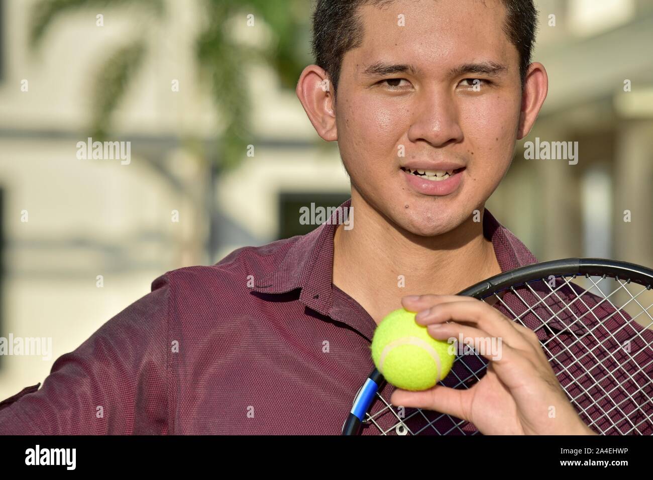 An Athlete Asian Tennis Player Smiling Stock Photo - Alamy