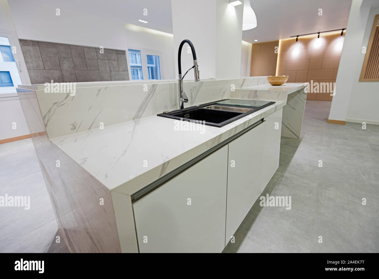 View of Interior design decor showing modern kitchen with sink and island in ...