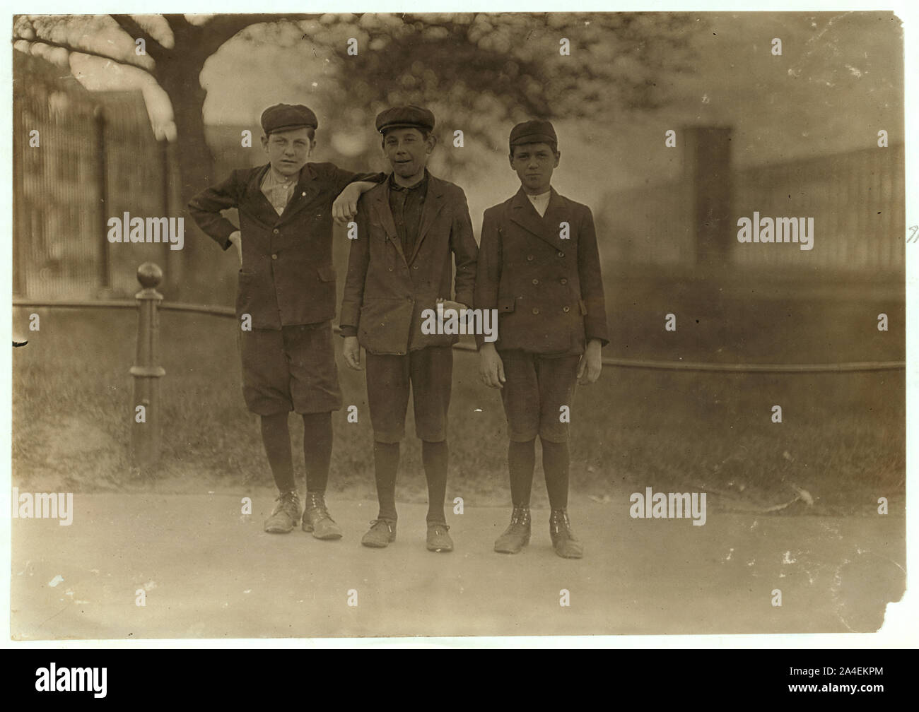 These boys work in Amoskeag Mills, Manchester, N.H. Emil Brassaid, 364 Collegiate St. Adolph Belodern, 441 Vernon St. Oscar Pronla, 174 Cartier St. E. W. Lord, witness. He counted 30 children coming out of this gate that appeared to be under 14 years. Stock Photo