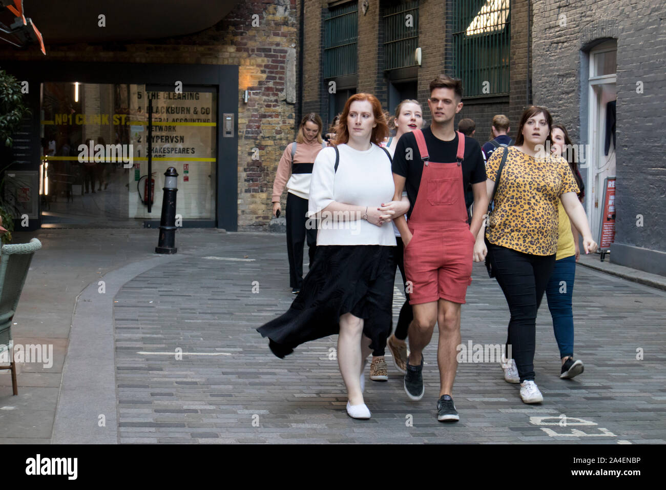 LONDON, ENGLAND - September 15, 2019, A group of friends walks along the South Bank of the Thames Stock Photo