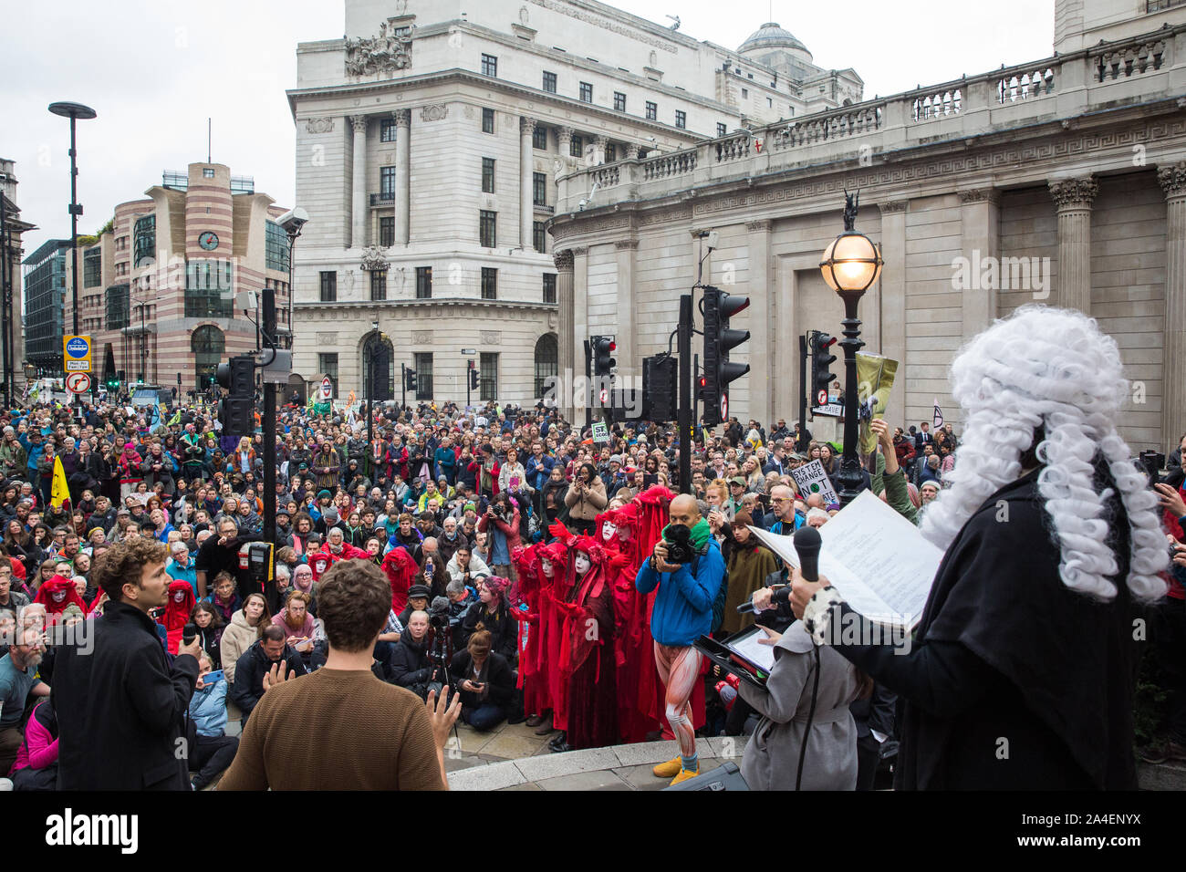 London, UK. 14 October, 2019. Climate activists from Extinction Rebellion stage theatrical mock trials, of the UK’s financial sector for the crime of ecocide and of the Government for ‘criminal negligence’ in having permitted it, in front of the Bank of England. Roads were blocked around Bank on the eighth day of International Rebellion protests across London. Credit: Mark Kerrison/Alamy Live News Stock Photo