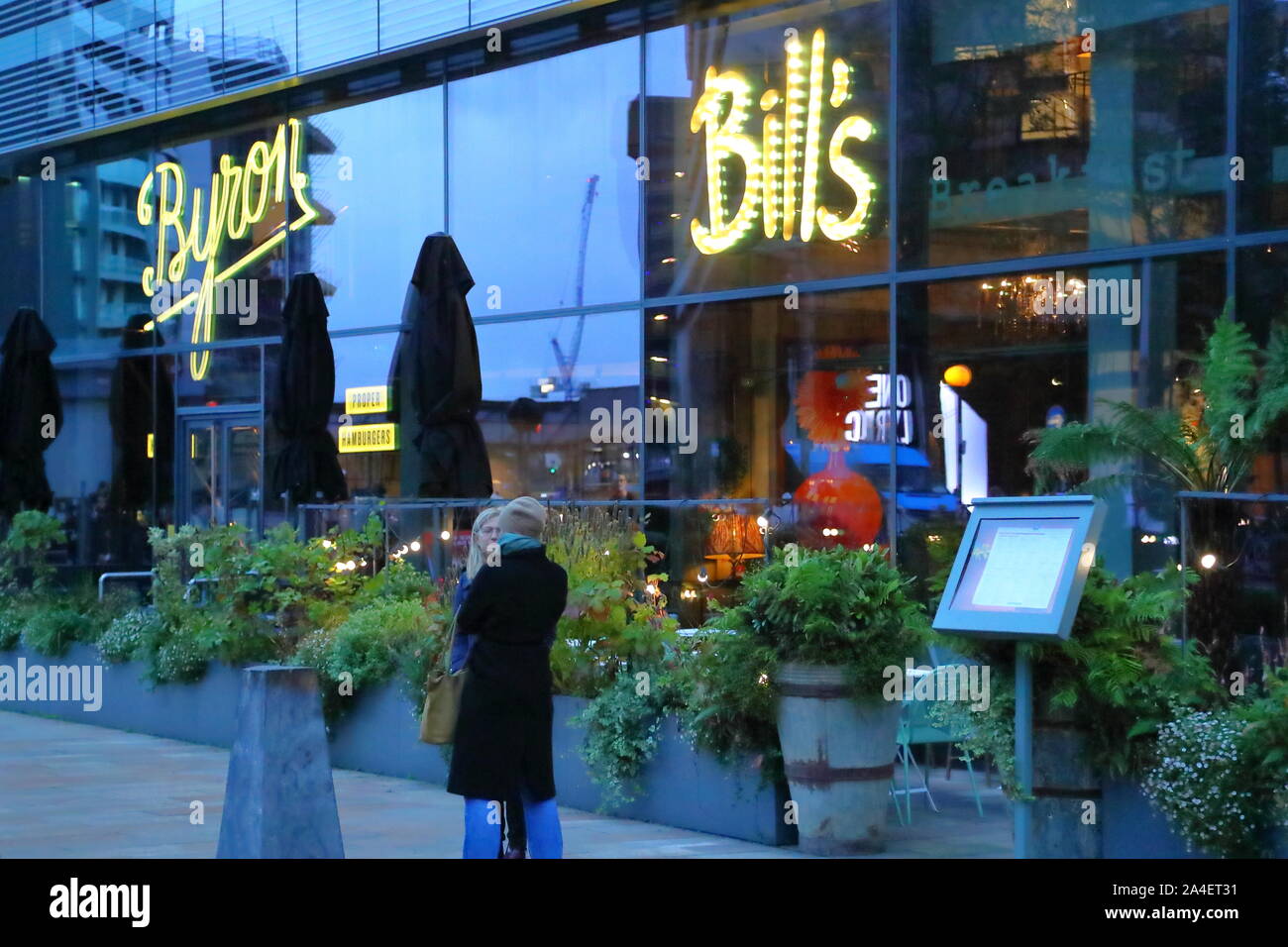 Front of Bill's Hammersmith Restaurant and Byron burger restaurant at night-time, London, UK Stock Photo