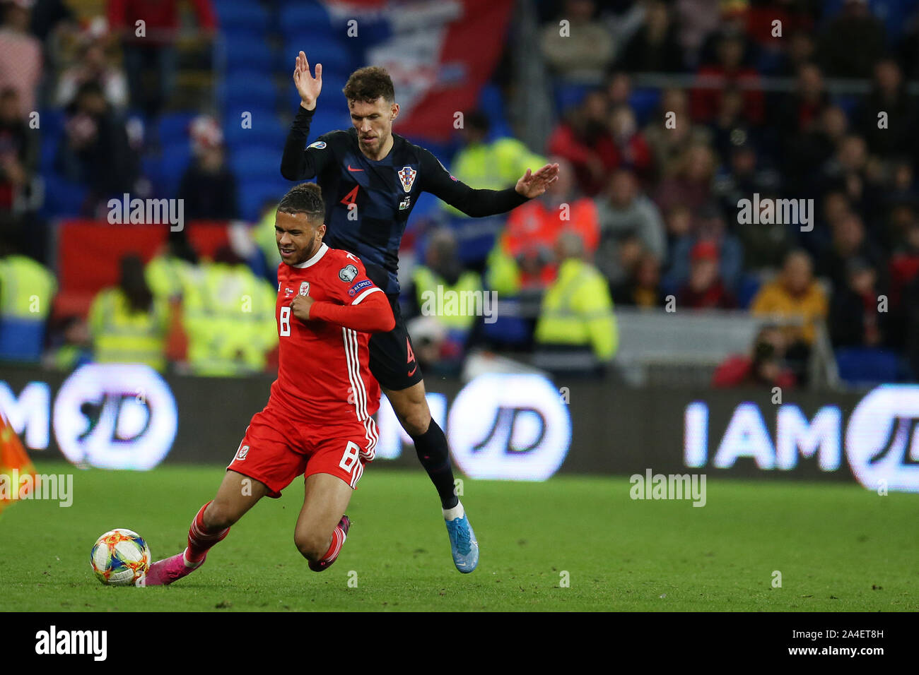 Cardiff, UK. 13th Oct, 2019. Tyler Roberts of Wales is tackled by Ivan Perisic of Croatia.UEFA Euro 2020 qualifier match, Wales v Croatia at the Cardiff city Stadium in Cardiff, South Wales on Sunday 13th October 2019. pic by Andrew Orchard /Andrew Orchard sports photography/Alamy live News EDITORIAL USE ONLY Credit: Andrew Orchard sports photography/Alamy Live News Stock Photo
