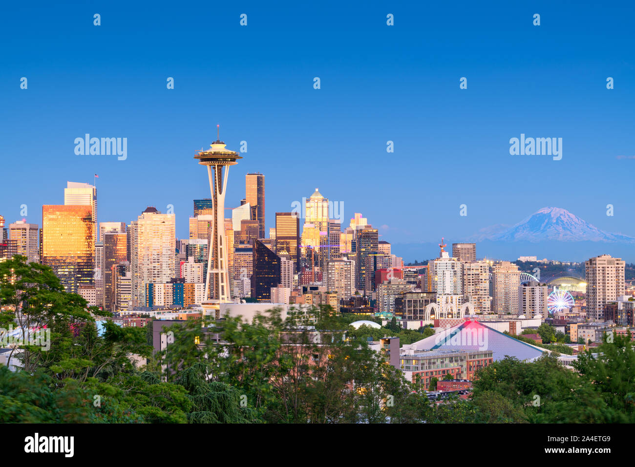 Seattle, Washington, USA downtown skyline at night with Mt. Rainier. Stock Photo
