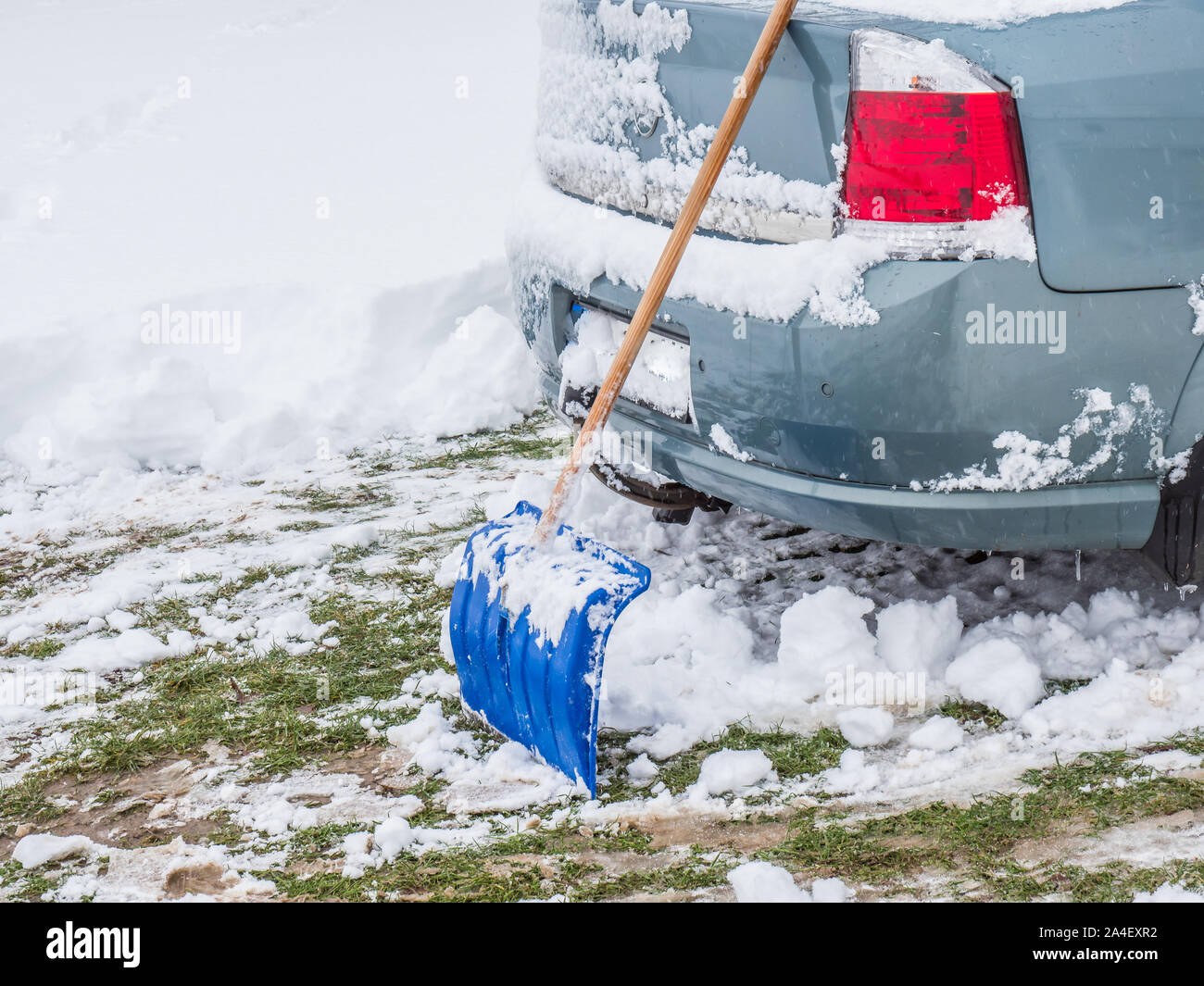 Snow shovel on the car Stock Photo - Alamy