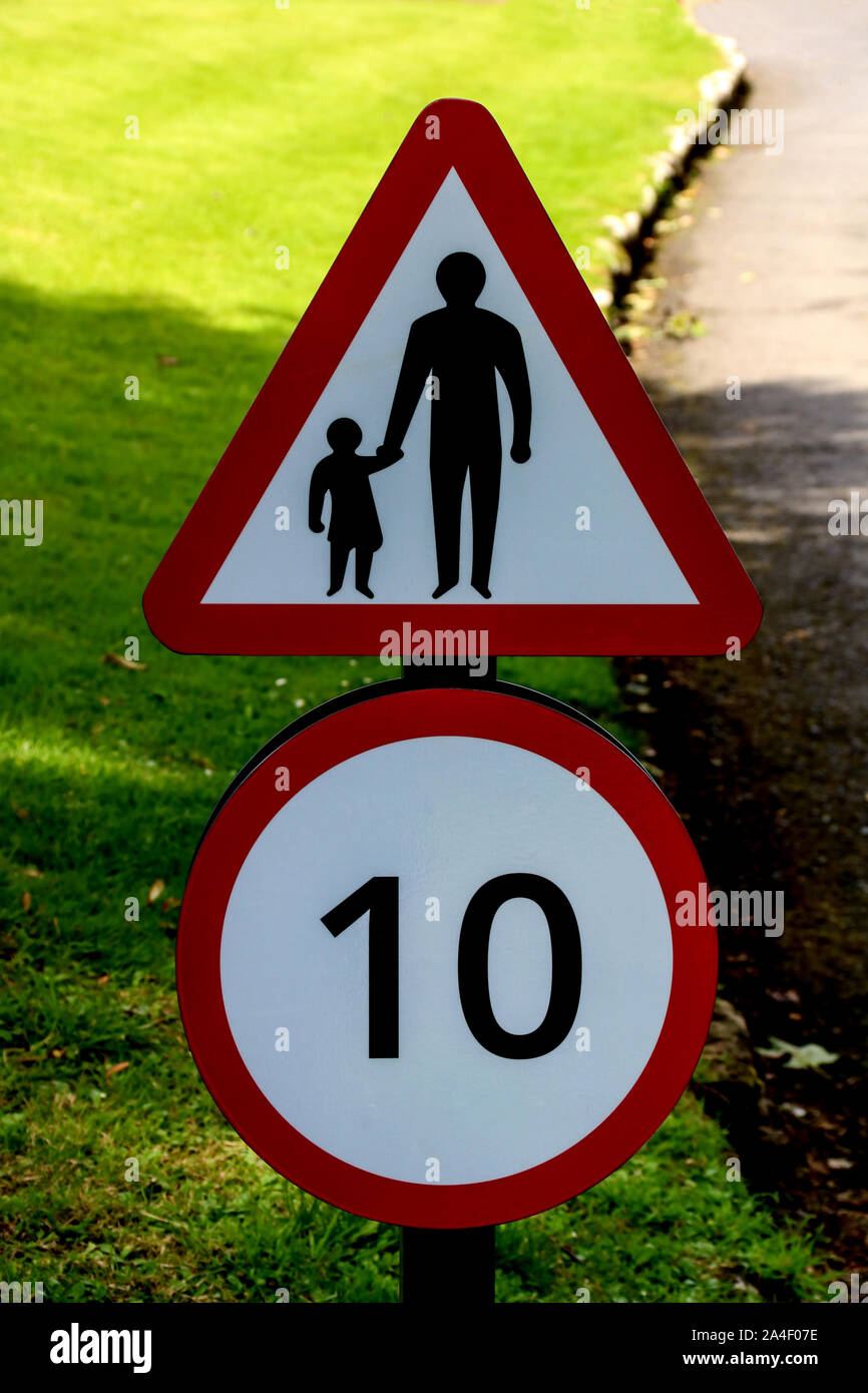 Speed and children walking warning sign on a rural road Stock Photo