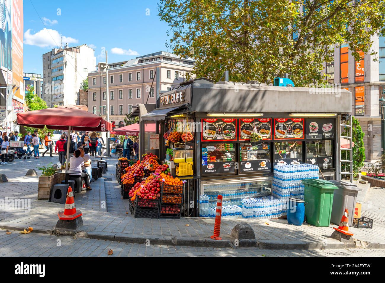 Tourists and Turks visit an outdoor market featuring fruit, produce and groceries in the Galata district near the bridge and the Golden Horn in Istanb Stock Photo