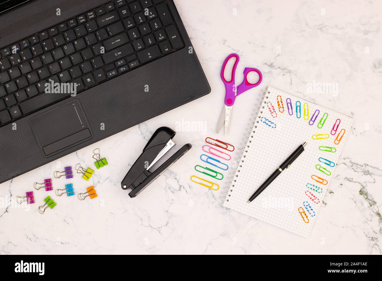 op view of office table. Office supplies on the table Stock Photo Alamy