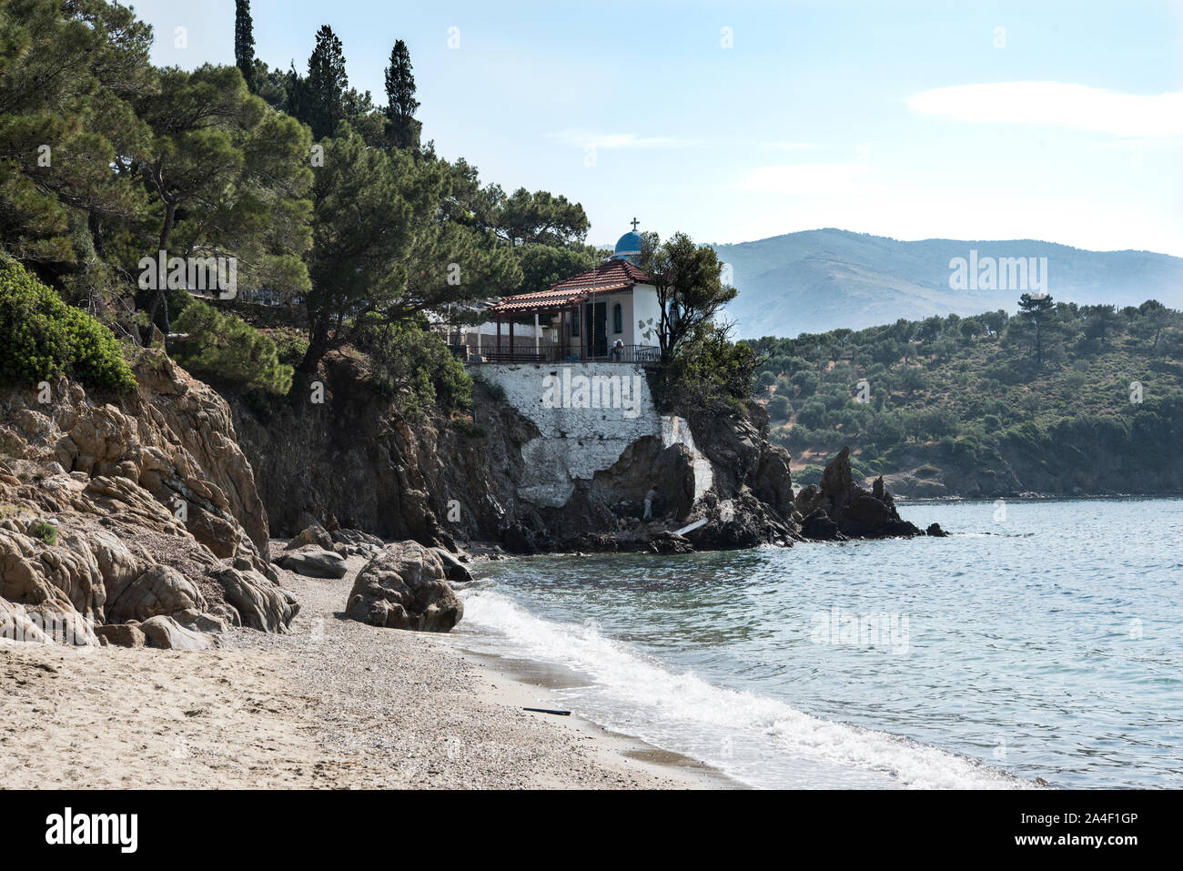 The beach and Church at Par Ermogenis, Lesbos, Greece. Stock Photo