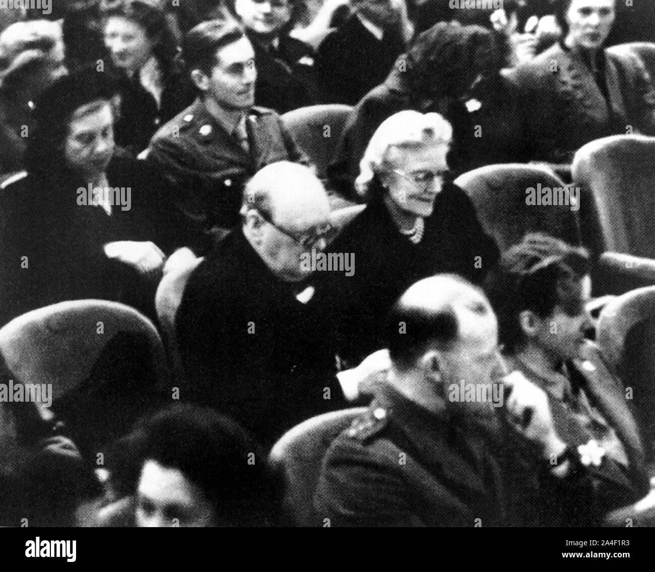 Winston Churchill accompanying his wife to the Old Vic theatre, London. to see a performance of George Bernard Shaw's play 'Arms and the Man'. 3/10'44 Stock Photo