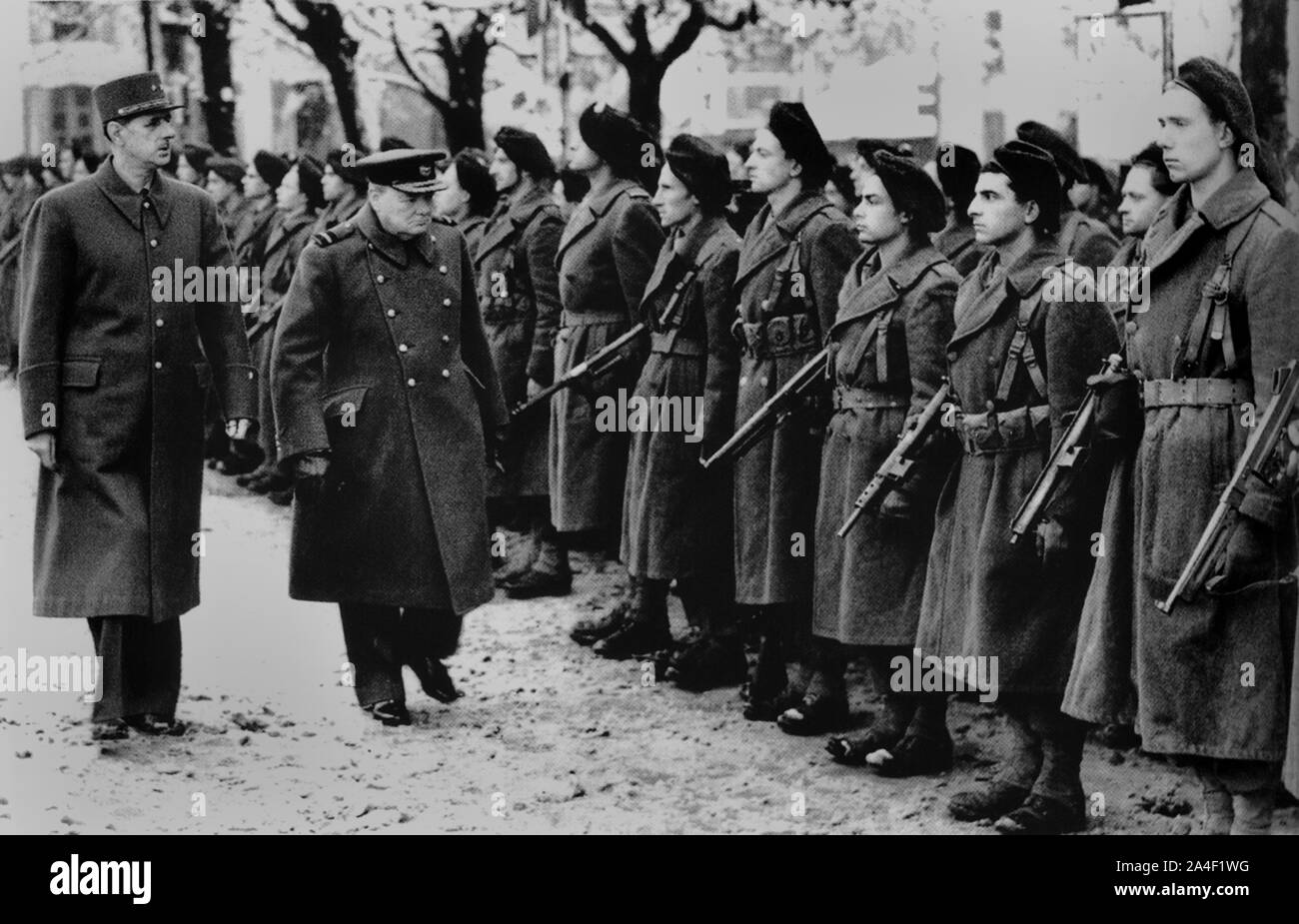 Winston Churchill with General Charles De Gaulle inspecting Free French troops near Besancon. 13th November 1944 Stock Photo
