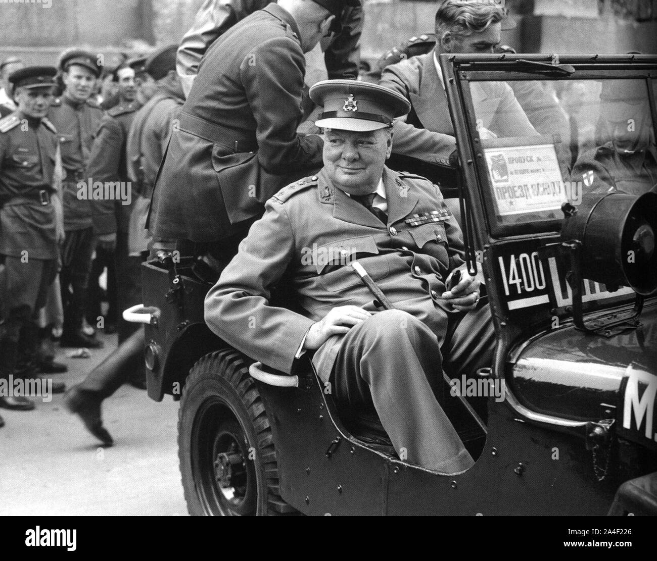 Winston Churchill visits the ruins of Berlin. Soviet soldiers look on. 16th July 1945 Stock Photo