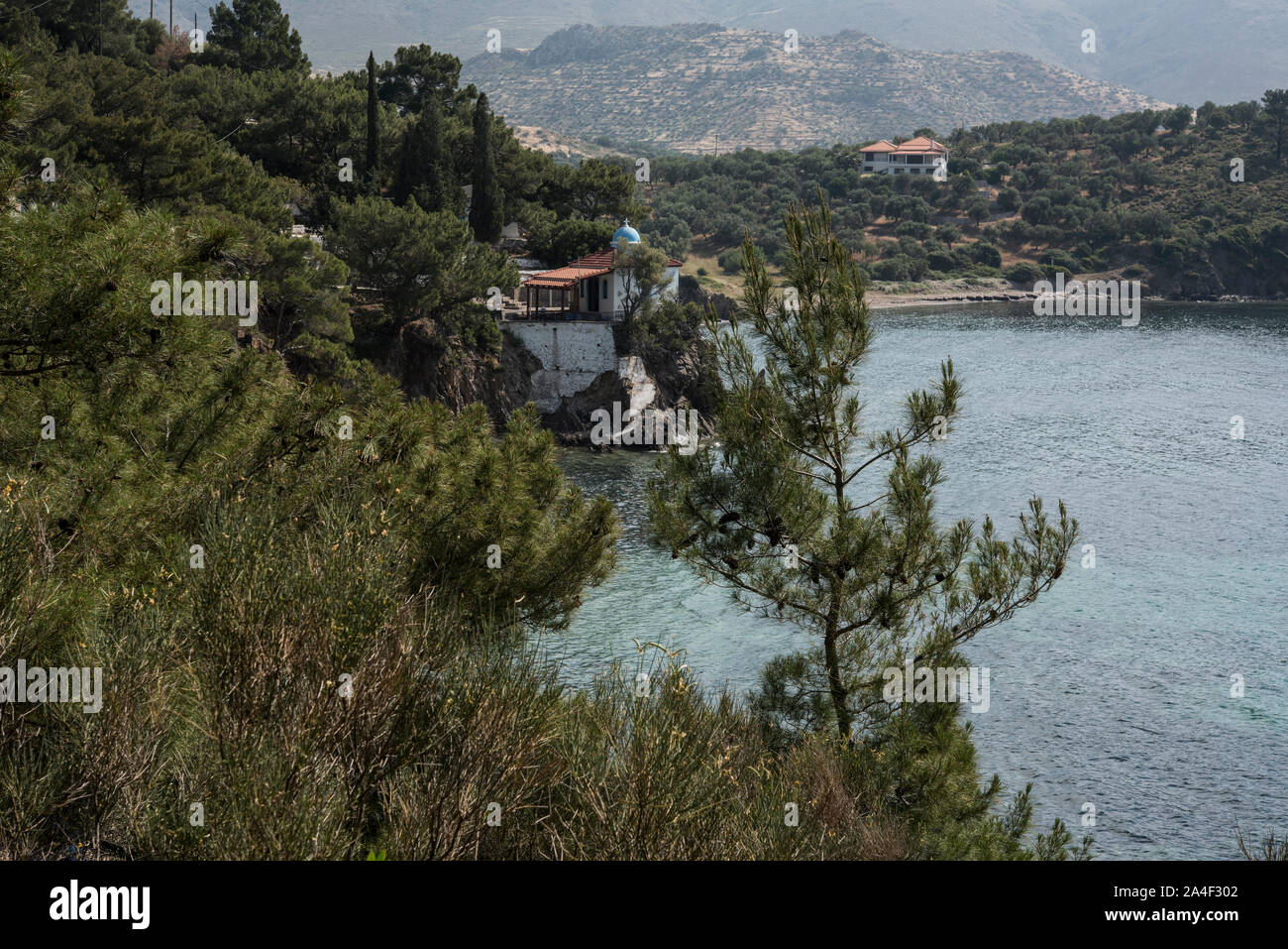 The beach and Church at Par Ermogenis, Lesbos, Greece. Stock Photo