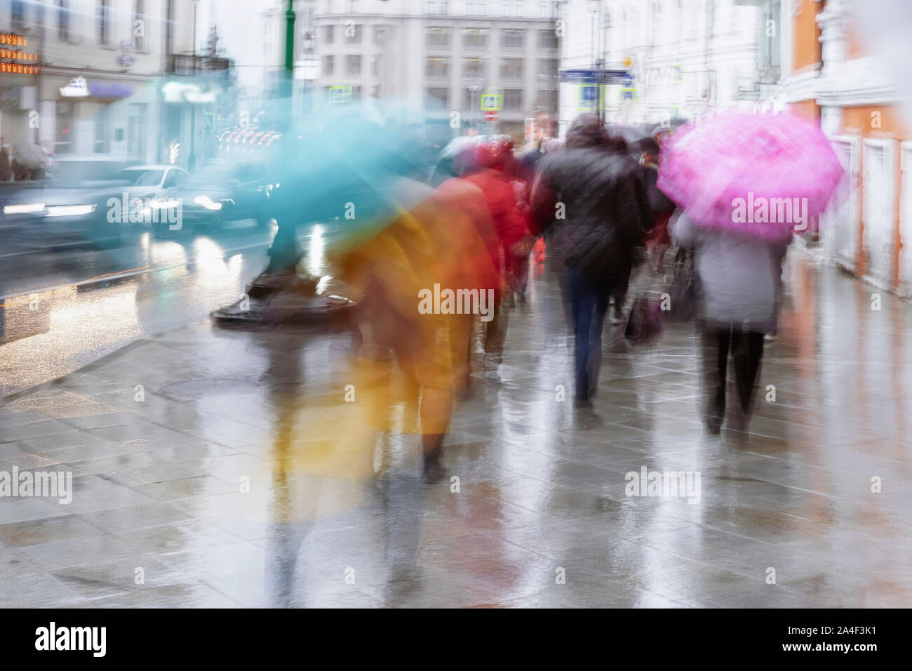 People under the umbrellas. Rainy evening in the city street at autumn ...