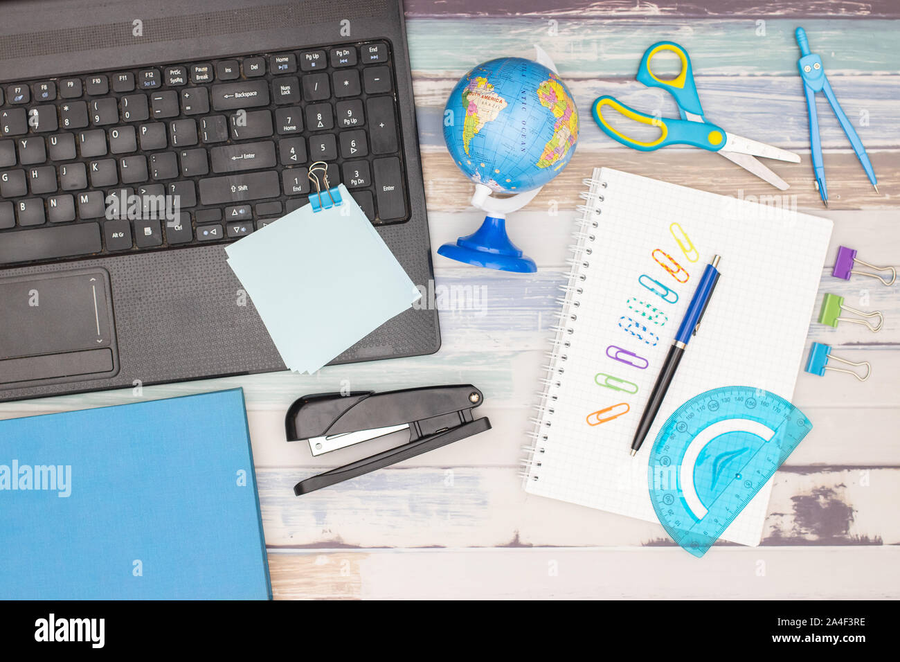 op view of office table. Office supplies on the table Stock Photo Alamy