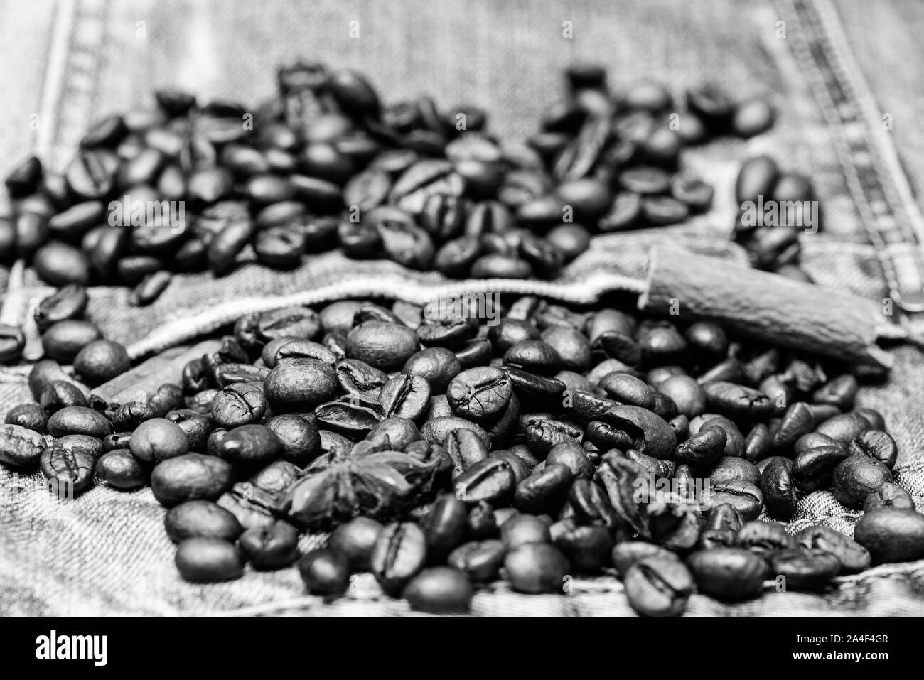 Fresh roasted coffee close up. Beans and spices in jeans pocket. Coffee