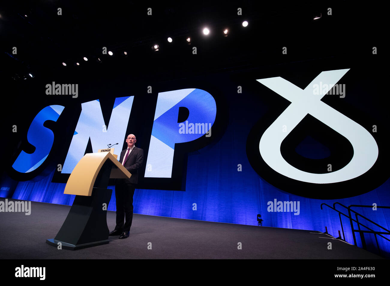 Deputy First Minister John Swinney delivers his address to delegates during the 2019 SNP autumn conference at the Event Complex in Aberdeen. Stock Photo