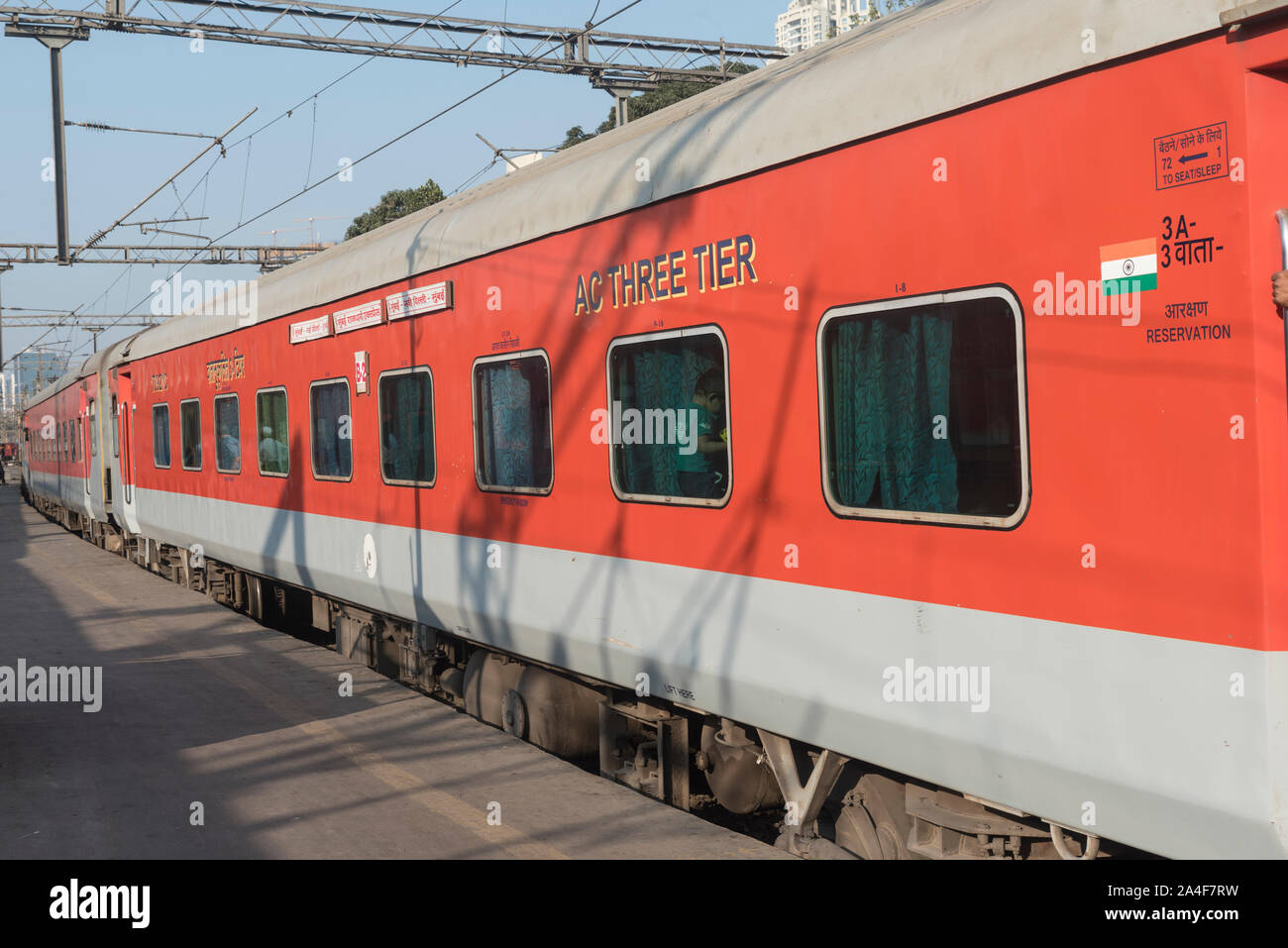 The Mumbai Rajdhani express red luxury train ready to depart from Mumbai central station in India. Stock Photo