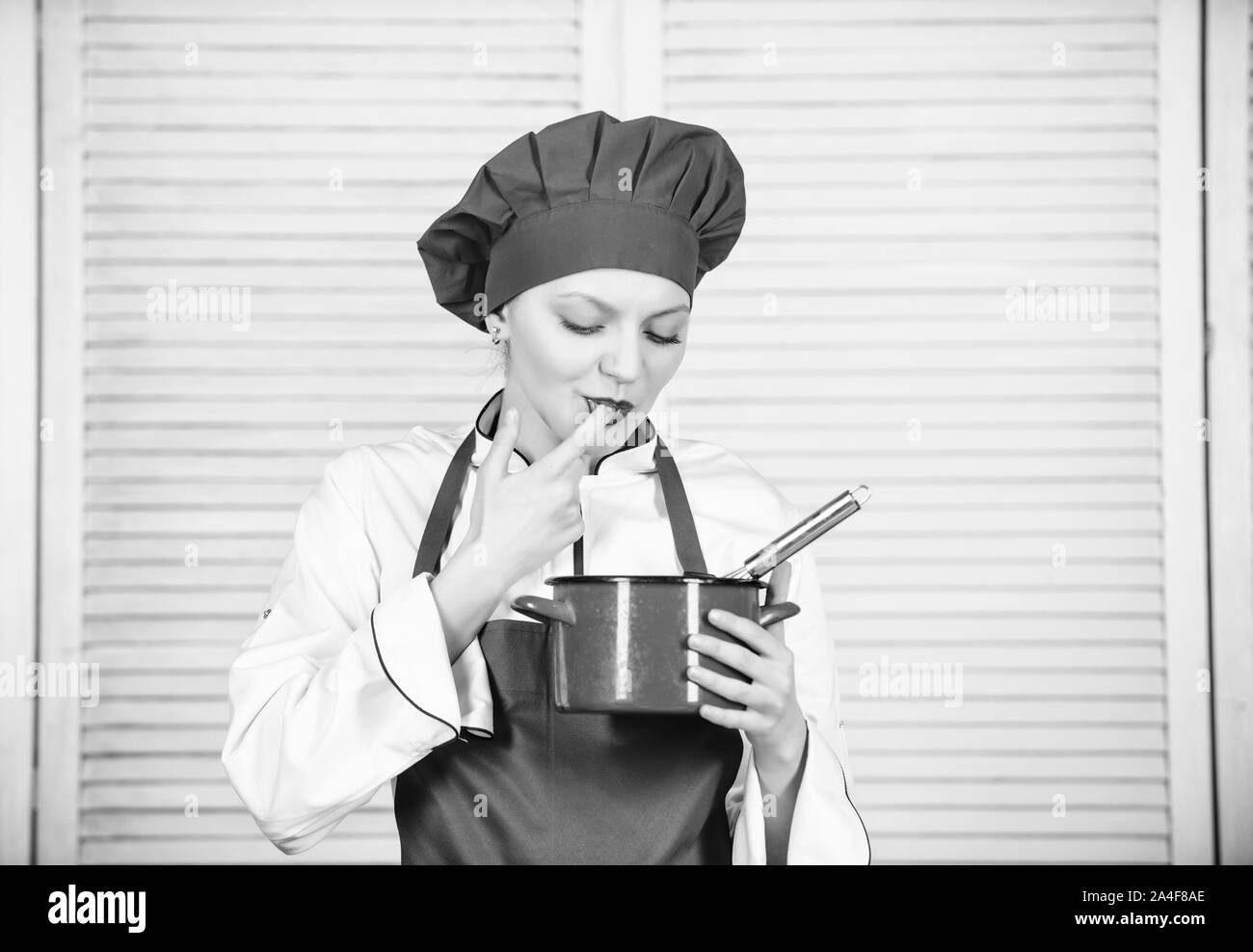 Butter cream. Use hand whisk. Woman chef hold whisk and pot. Girl in
