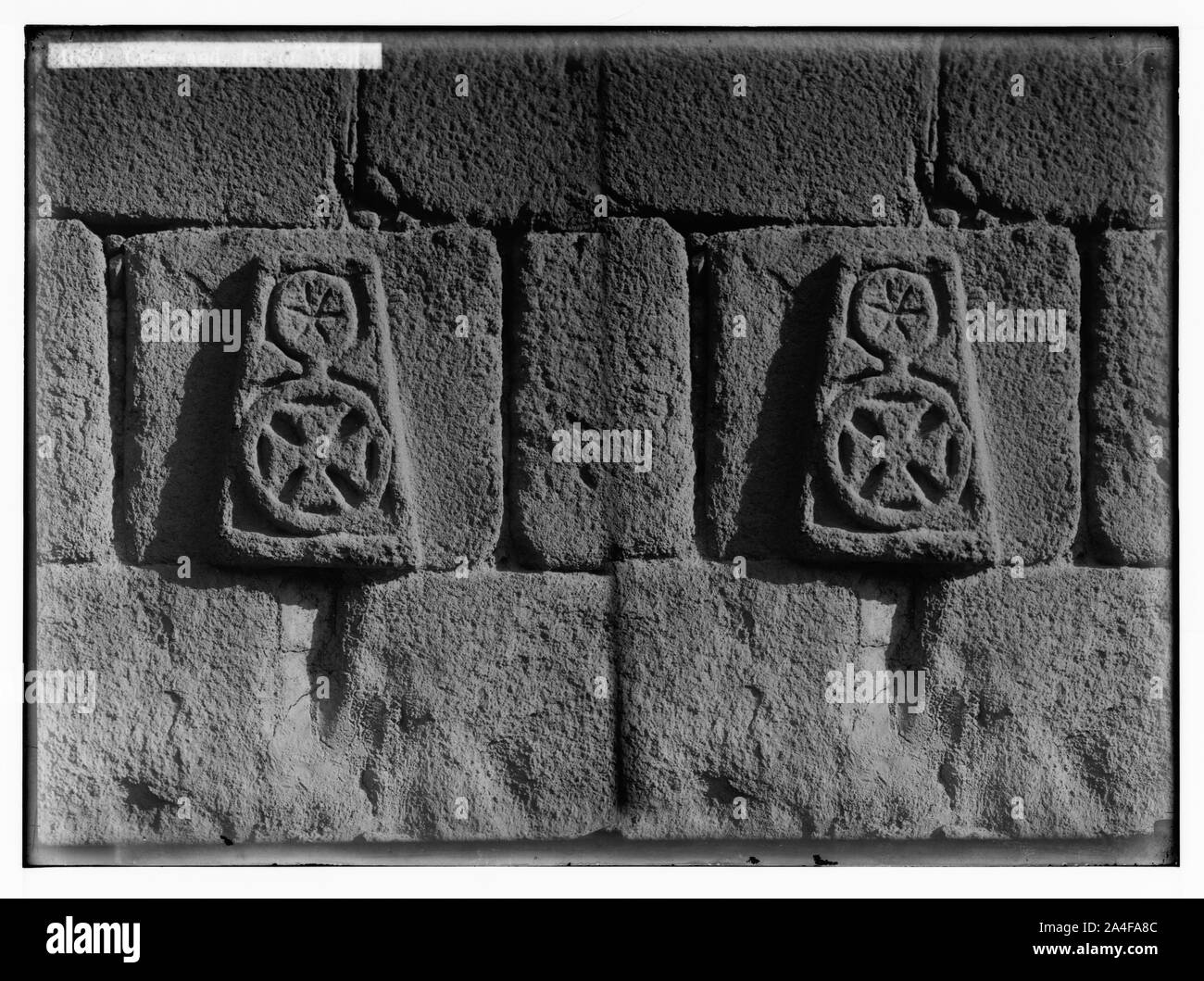 To Sinai via the Red Sea, Tor, and Wady Hebran. Cross and star on wall [Monastery of St. Catherine]. Stock Photo