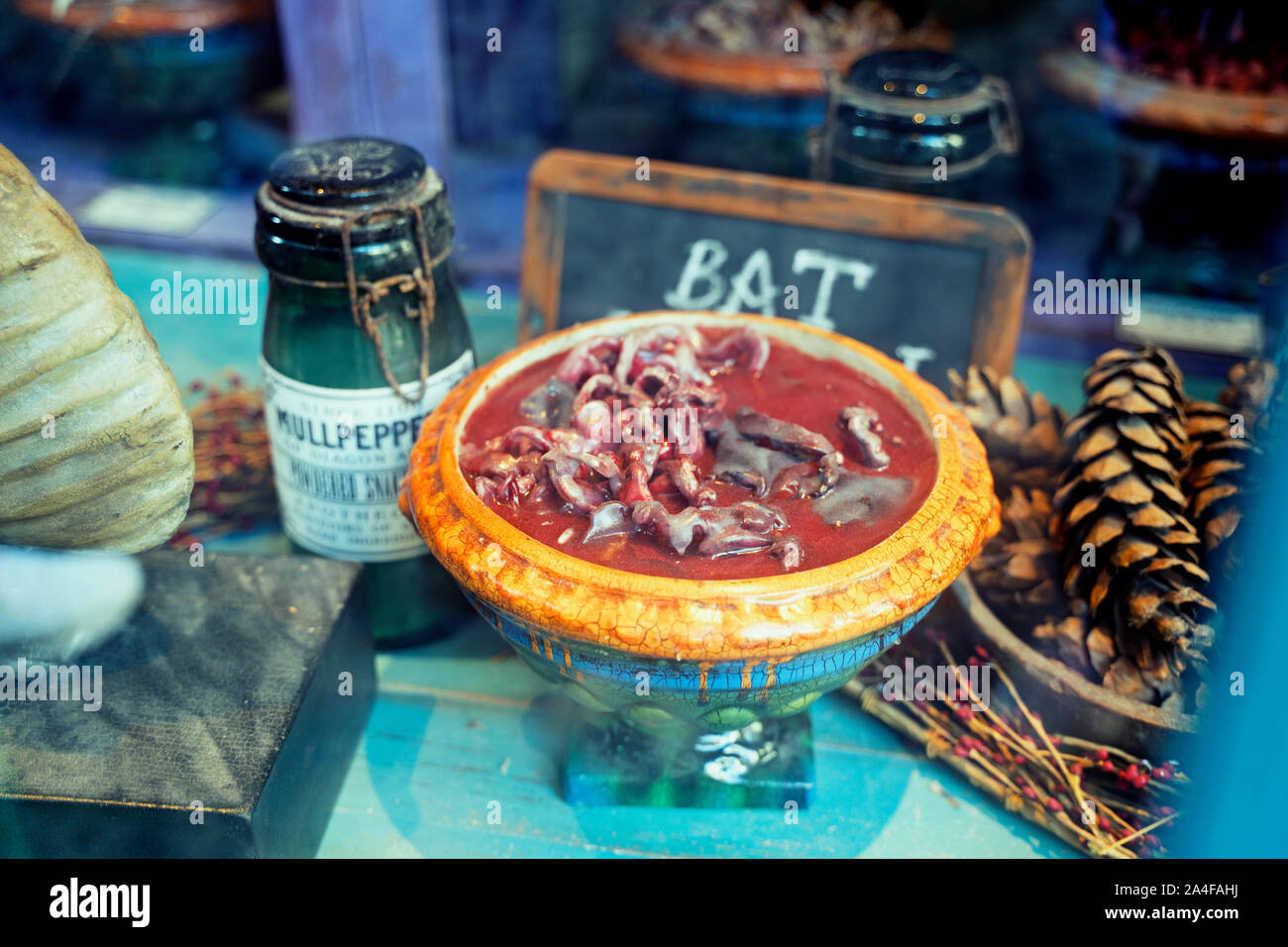 Mr. Mullpepper's Apothecary at Diagon Alley, Bottles, Potions, Bowl of Bat Spleen in shop window, Wizarding World of Harry Potter, Universal Studios Stock Photo