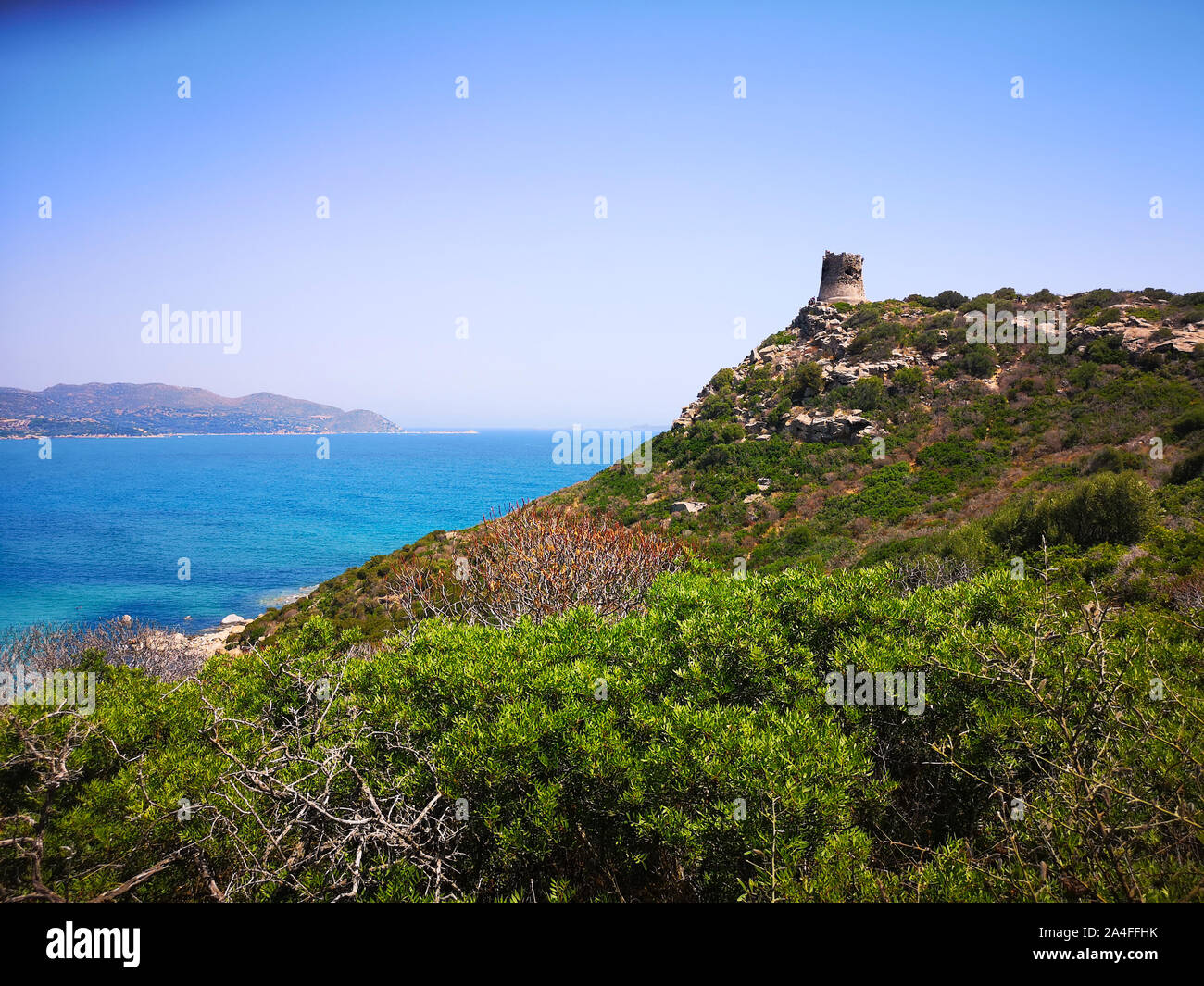 A view of the Spanish watchtower of Porto Giunco, Villasimius, Sardinia, Italy. Stock Photo