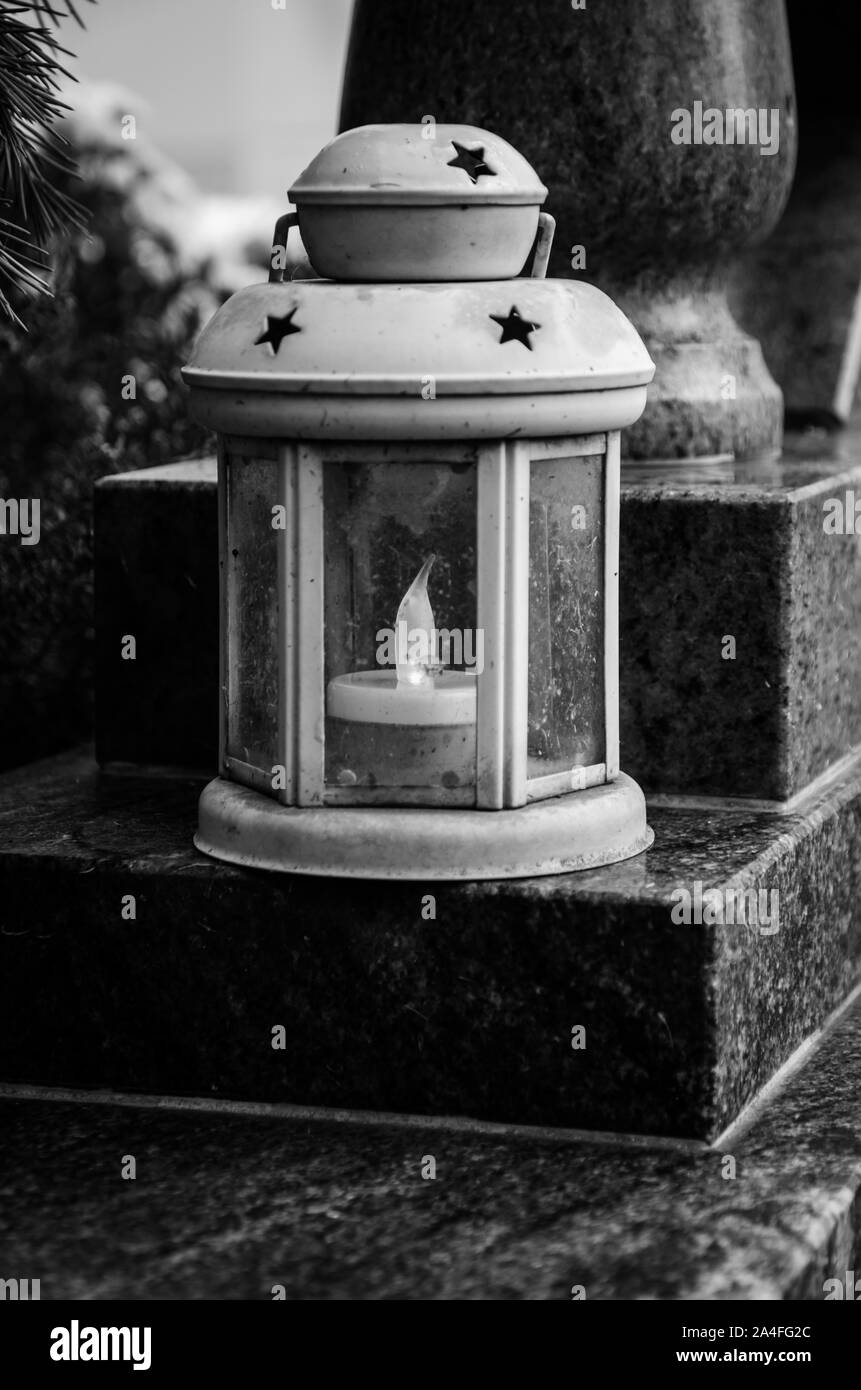 lantern in the grave black and white Stock Photo