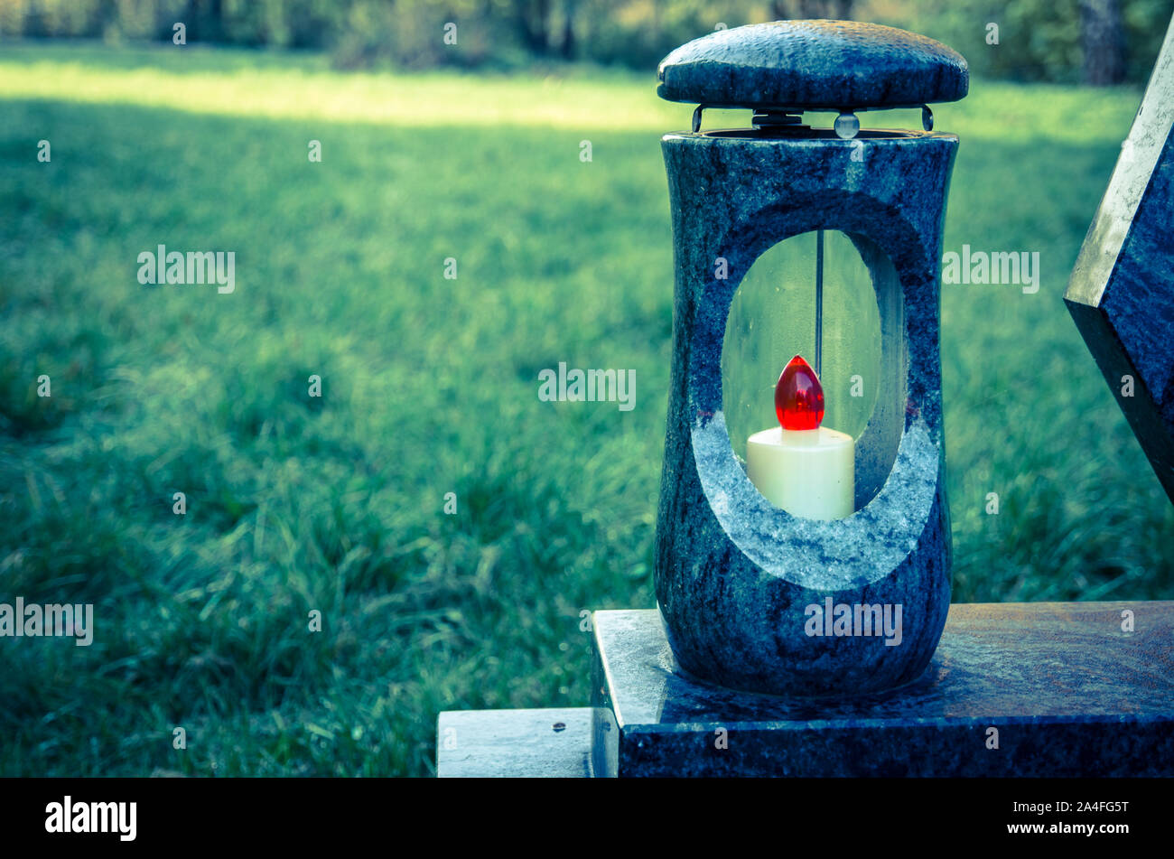 lantern with burning candle on the grave Stock Photo Alamy