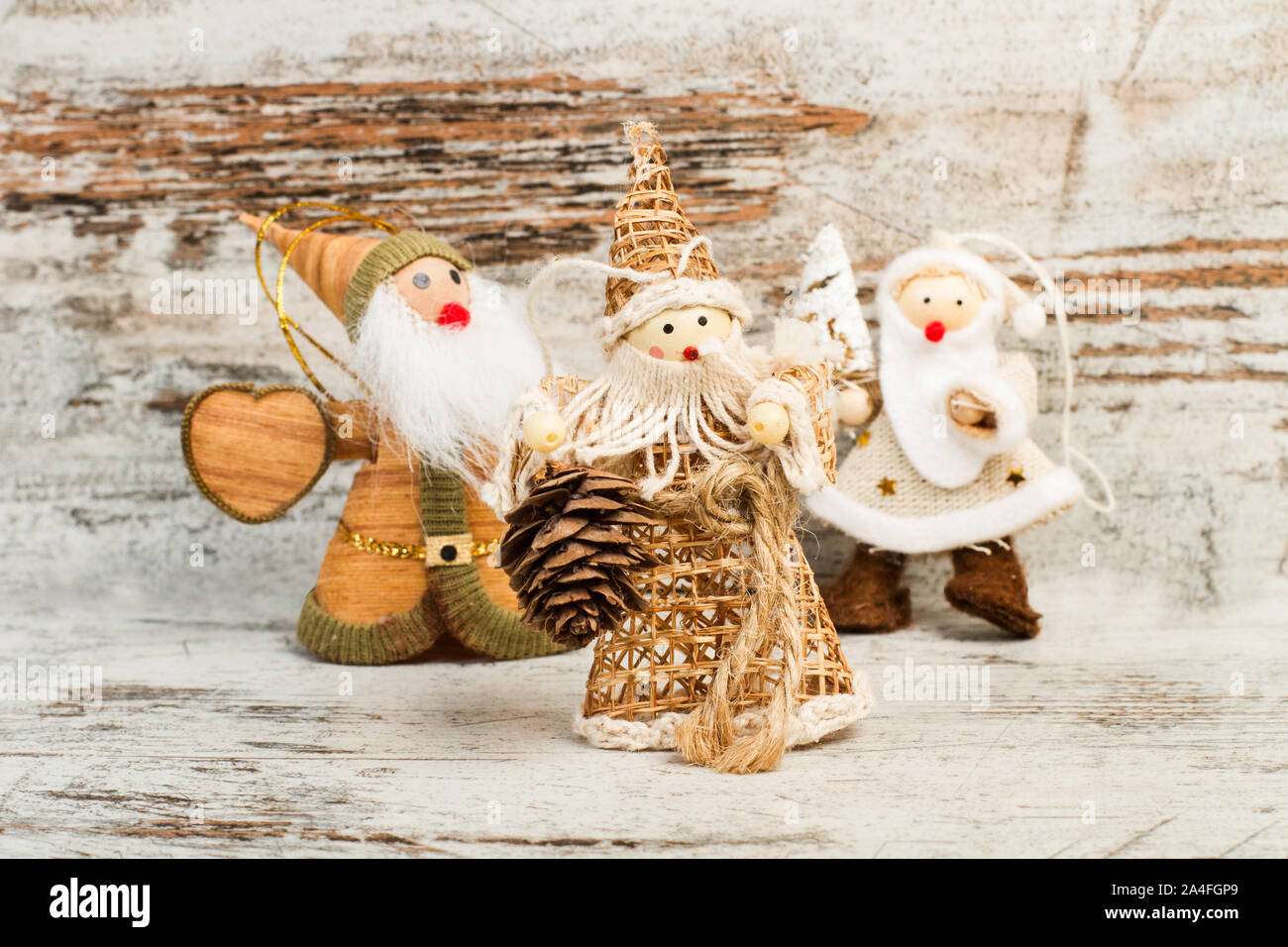 Christmas dolls made with fabric on a wooden table Stock Photo