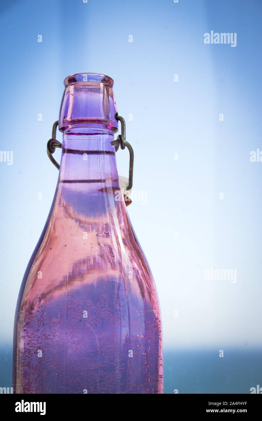 Classic transparent glass bottle with color Stock Photo - Alamy