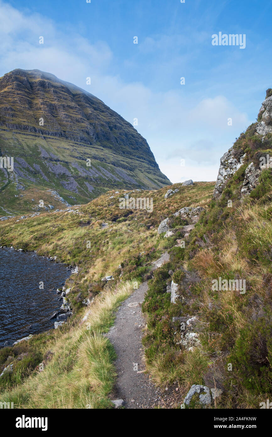 Path by Loch a' Choire Dubh to Suilven  mountain in Inverpoly National Nature Reserve Assynt Sutherland north face of  Caisteal Liath summit ahead Stock Photo
