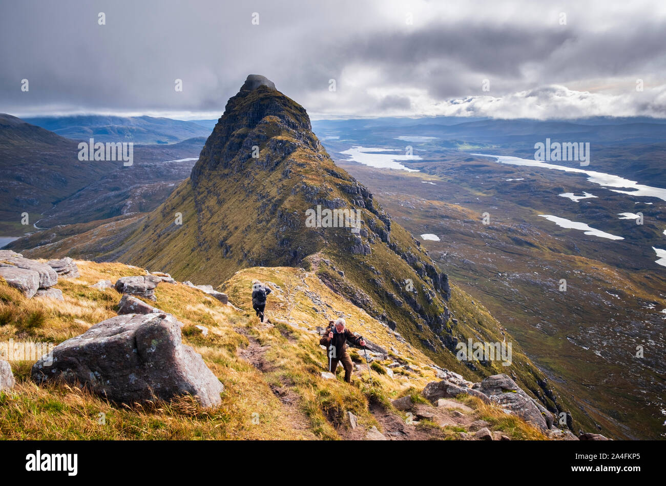 Climbers on Caisteal Liath on Suilven mountain in Inverpoly National Nature Reserve Assynt Sutherland along summit ridge to Meall Meadhonach Stock Photo