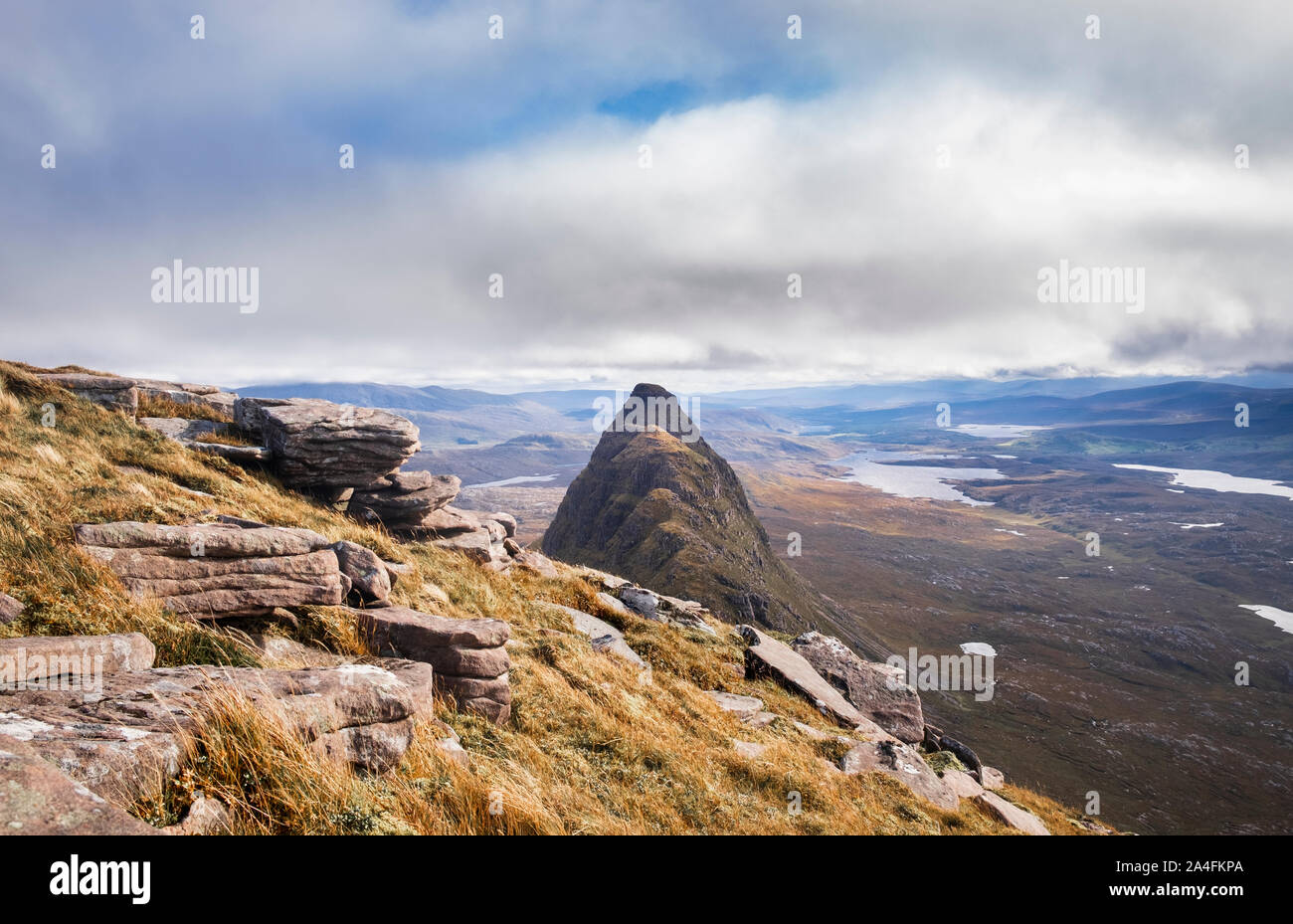 View from Caisteal Liath on Suilven mountain in Inverpoly National Nature Reserve Assynt Sutherland along summit ridge to Meall Meadhonach Stock Photo