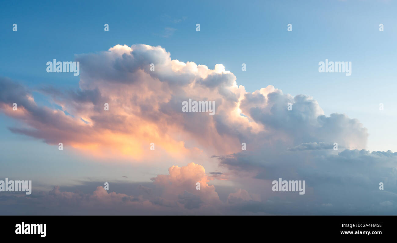 Blue sunset sky with many nice white clouds Stock Photo