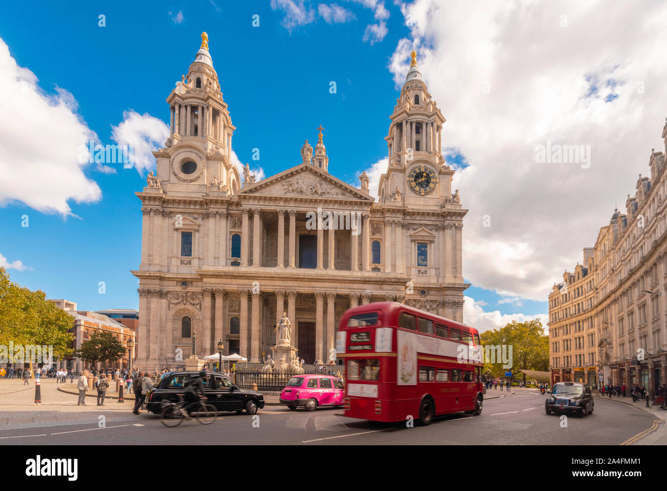 St Paul's Cathedral in sunny day with red bus and london taxi Stock Photo