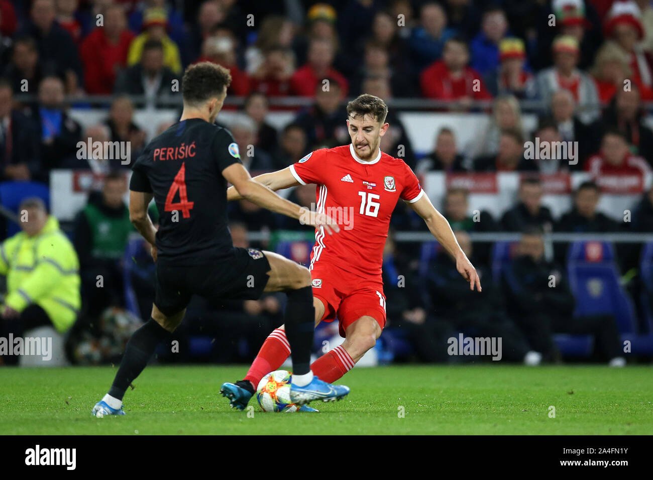 Cardiff, UK. 13th Oct, 2019. Tom Lockyer of Wales (16) is challenged by Ivan Perisic of Croatia. UEFA Euro 2020 qualifier match, Wales v Croatia at the Cardiff city Stadium in Cardiff, South Wales on Sunday 13th October 2019. pic by Andrew Orchard /Andrew Orchard sports photography/Alamy live News EDITORIAL USE ONLY Credit: Andrew Orchard sports photography/Alamy Live News Stock Photo