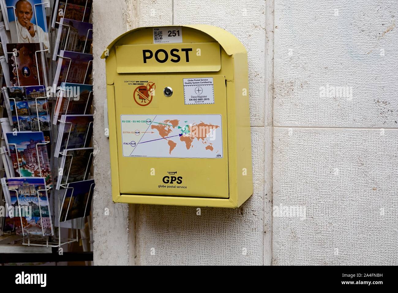 A GPS yelloe postbox in Rome, Italy Stock Photo